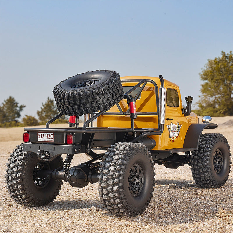 Yellow ROCHOBBY 1:10 Atlas 4x4 Off-Road Truck RS with spare tire and large off-road tires.