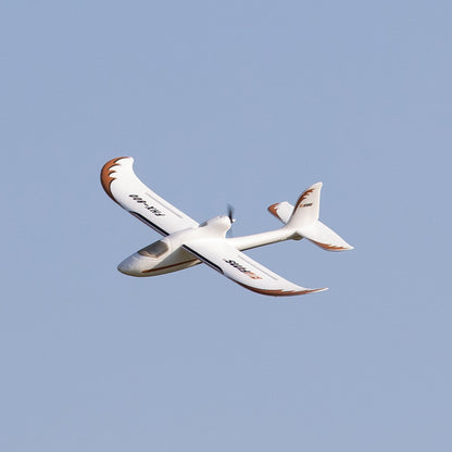 FMS Easy Trainer RTF flying in blue sky, showcasing white and orange design