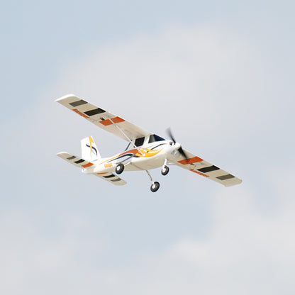 FMS 850mm Ranger airplane in flight with orange and black striped wings and flame graphics.