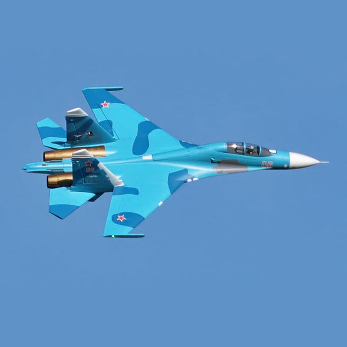 FMS Dual 70mm EDF SU-27 / J-11 PNP jet fighter in flight with blue camouflage.