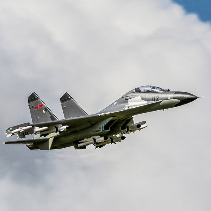 FMS Twin 70mm EDF J-11 PNP jet in flight, featuring twin engines, missiles, and a grey camouflage pattern.