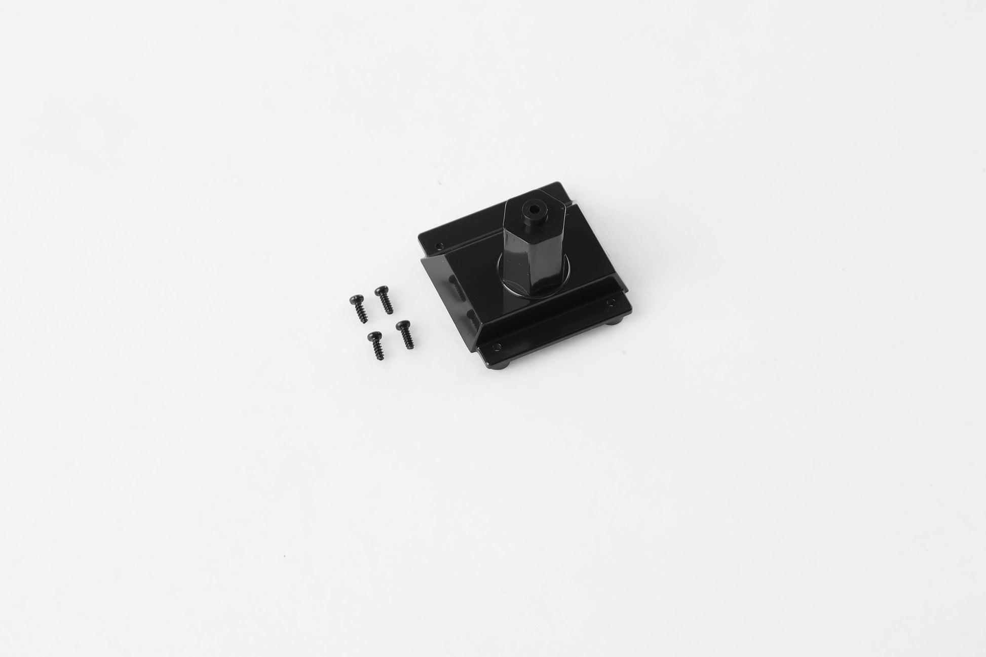 Black spare tire rack component with screws for RC vehicles