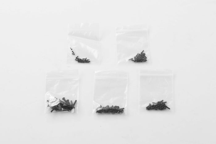 Small black screws and parts for 1:24 RC models in clear plastic bags