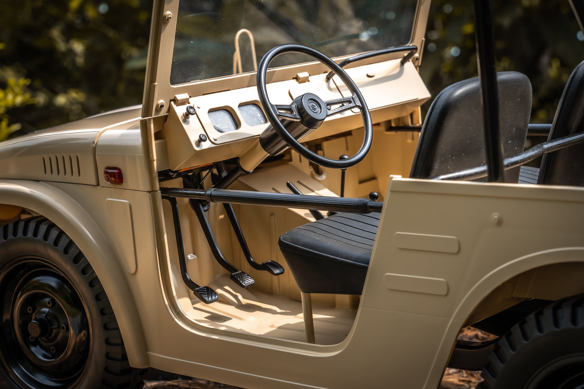 FMS 1:6 Jimny RS Brown RC car interior with beige dashboard, black steering wheel and seats.