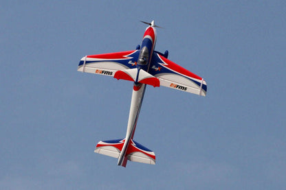 FMS 1400mm F3A Olympus PNP aerobatic RC plane with red, white, and blue graphics in flight.
