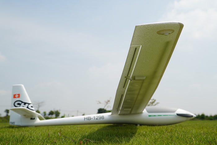FMS 2500mm ASW-17 EP Glider PNP RC airplane on grass, white fuselage, Swiss flag tail emblem