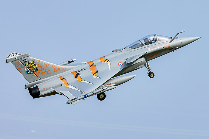 FMS 64mm Rafale jet, NATO Tiger Meet livery, flying with landing gear down. Tiger graphic & orange claw marks.