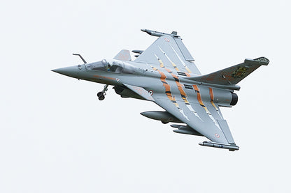 FMS 64mm Rafale jet, NATO Tiger Meet livery, flying with landing gear down. Orange tiger stripes.