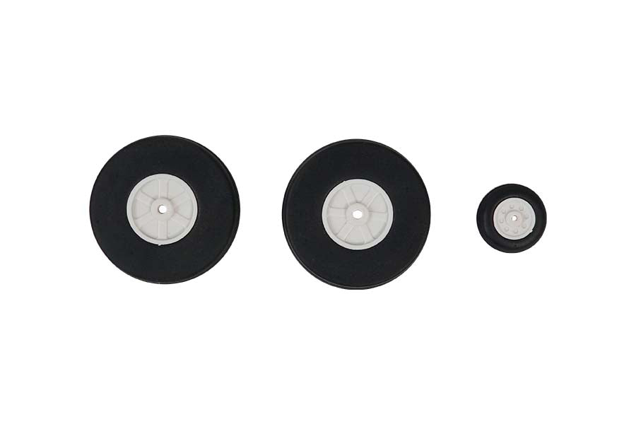 Set of three 1100mm P-51 tires: two large, one small, with black rubber and white hubs.