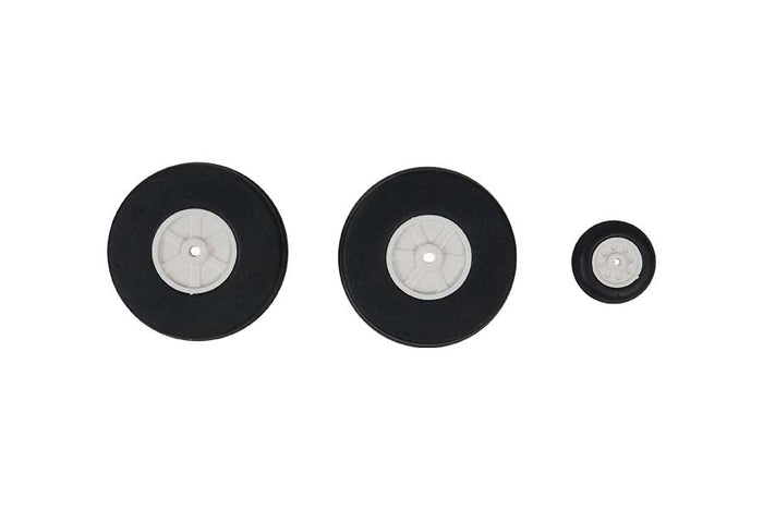 Set of three 1100mm P-51 tires: two large, one small, with black rubber and white hubs.