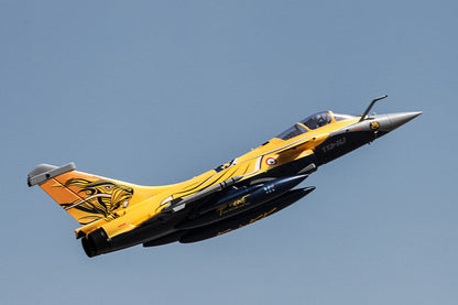 FMS 80mm Rafale EDF jet with yellow livery and tiger graphic, in flight.