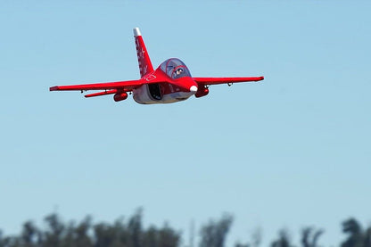 Red FMS EDF Jet Yak-130 V2 PNP model aircraft flying in clear blue sky.