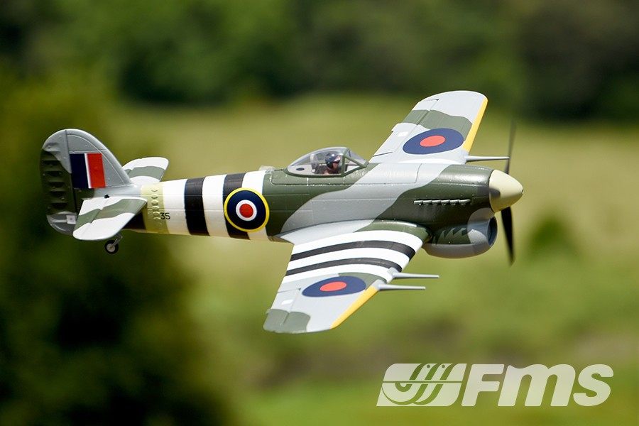 FMS 1100mm Hawker Typhoon PNP scale model aircraft in flight, featuring camouflage paint and British roundels.