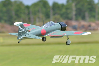 FMS 1100mm A6M5 Zero PNP RC warbird in flight, featuring scale details and red Hinomaru markings.